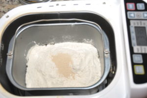 bread ingredients in bread machine pan.