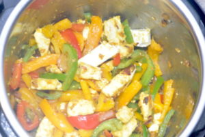 paneer and capsicum being cooked.