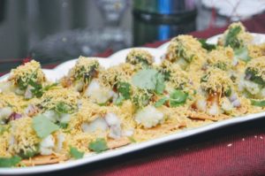 sev puri served in a tray.