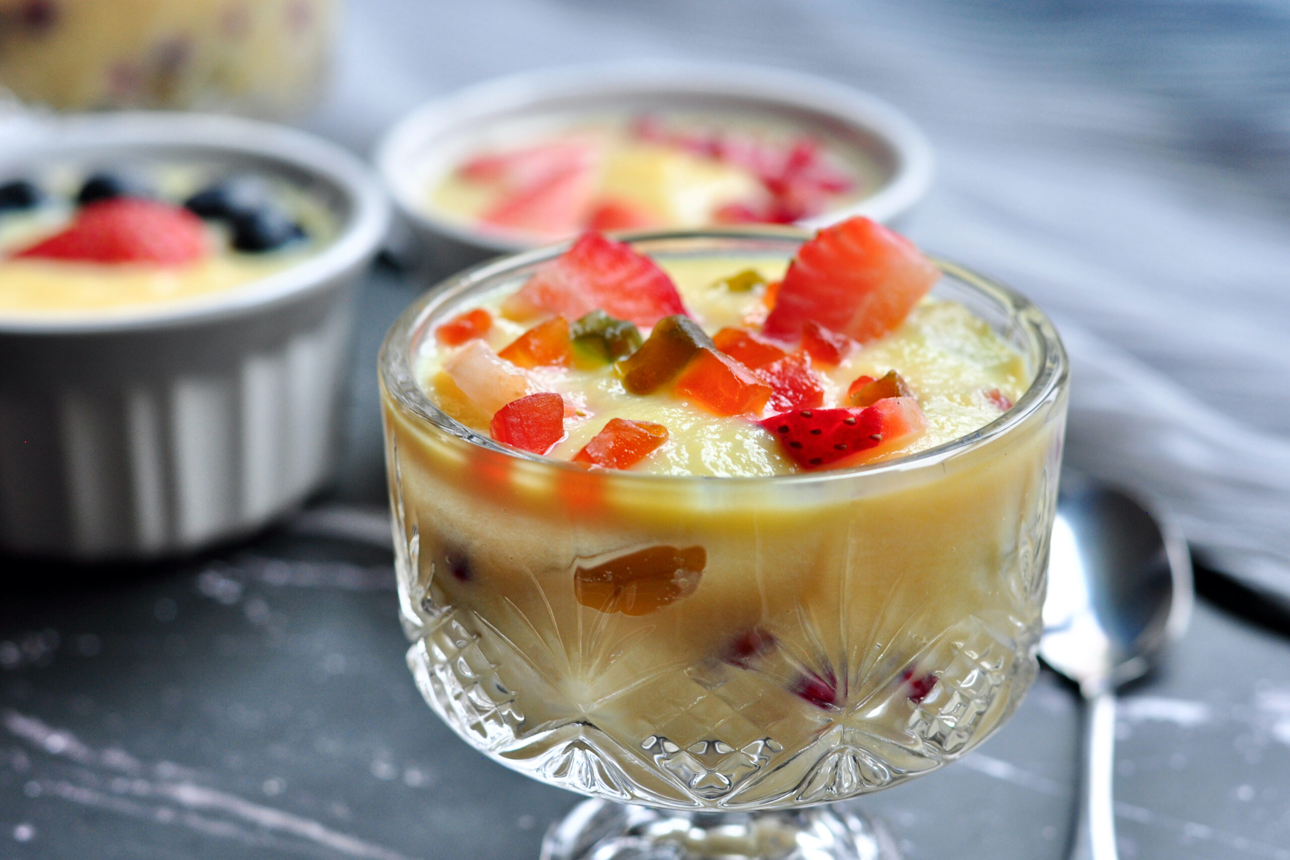 indian custard in a bowl with fruits.