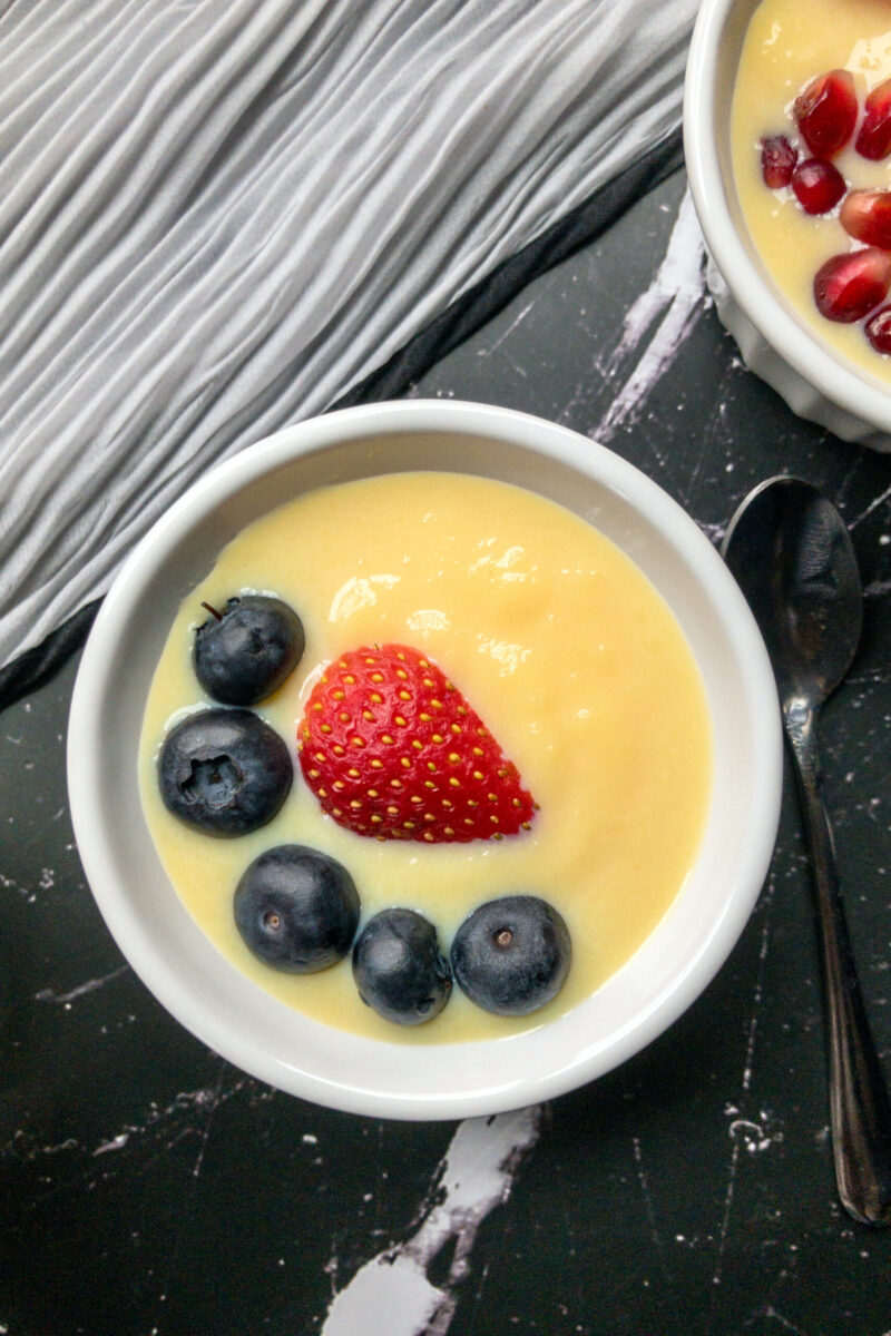 indian custard in a bowl with fruits