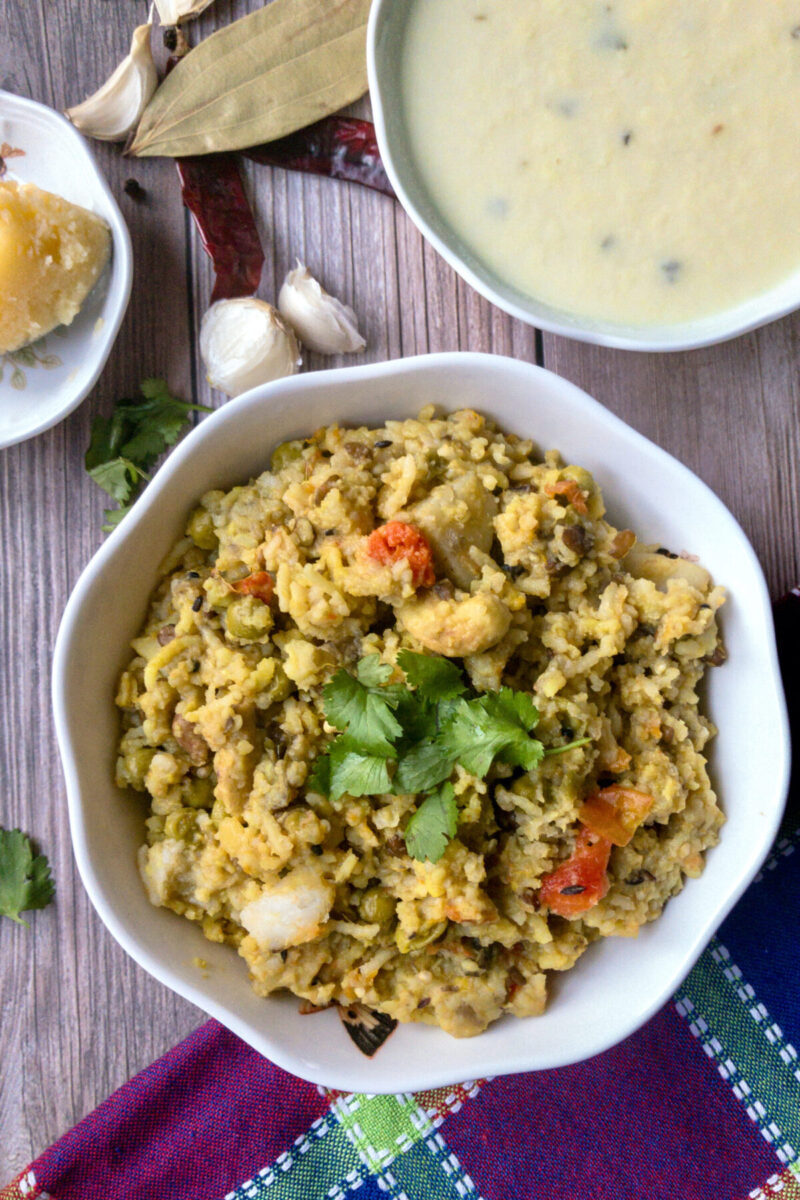 instant pot khichadi in a bowl with kadhi in background