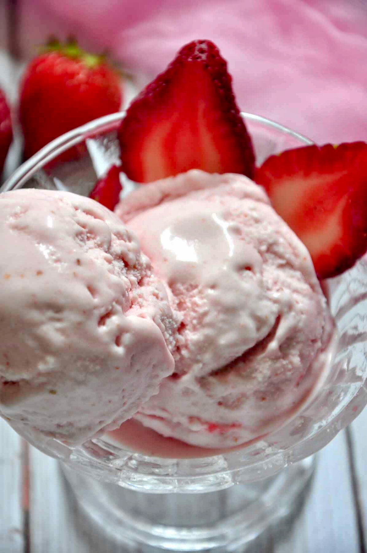 strawberry ice cream scoops in a bowl