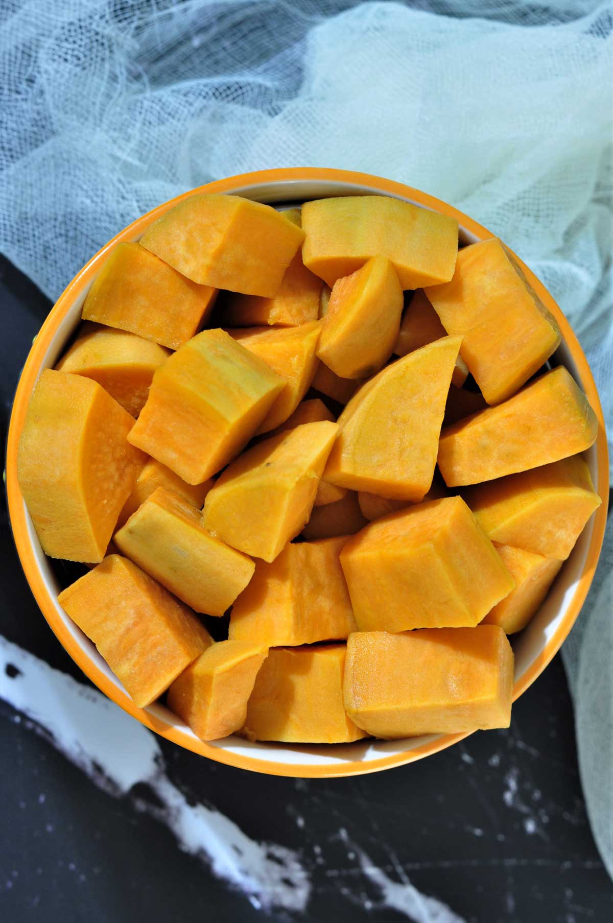 cooked cube sweet potatoes in a bowl