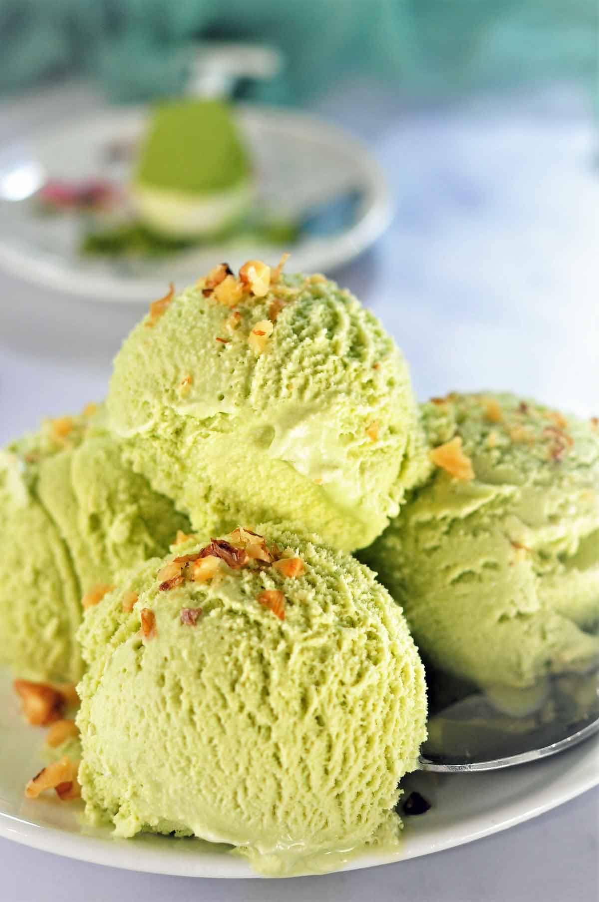 Matcha ice cream scoops served in a plate.