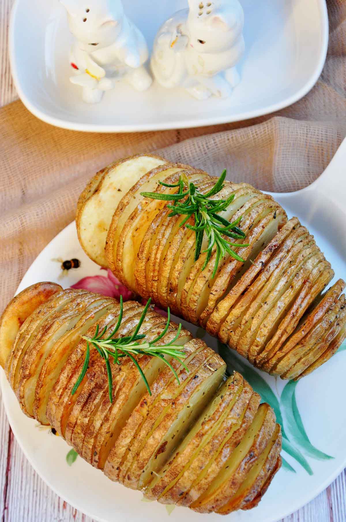 Air fried Hasselback potatoes served on a cheese board.