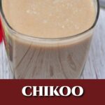 Chikoo milkshake in a glass with straw.