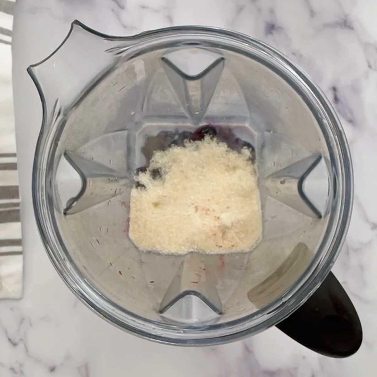 Blueberry ice cream ingredients in a blender.