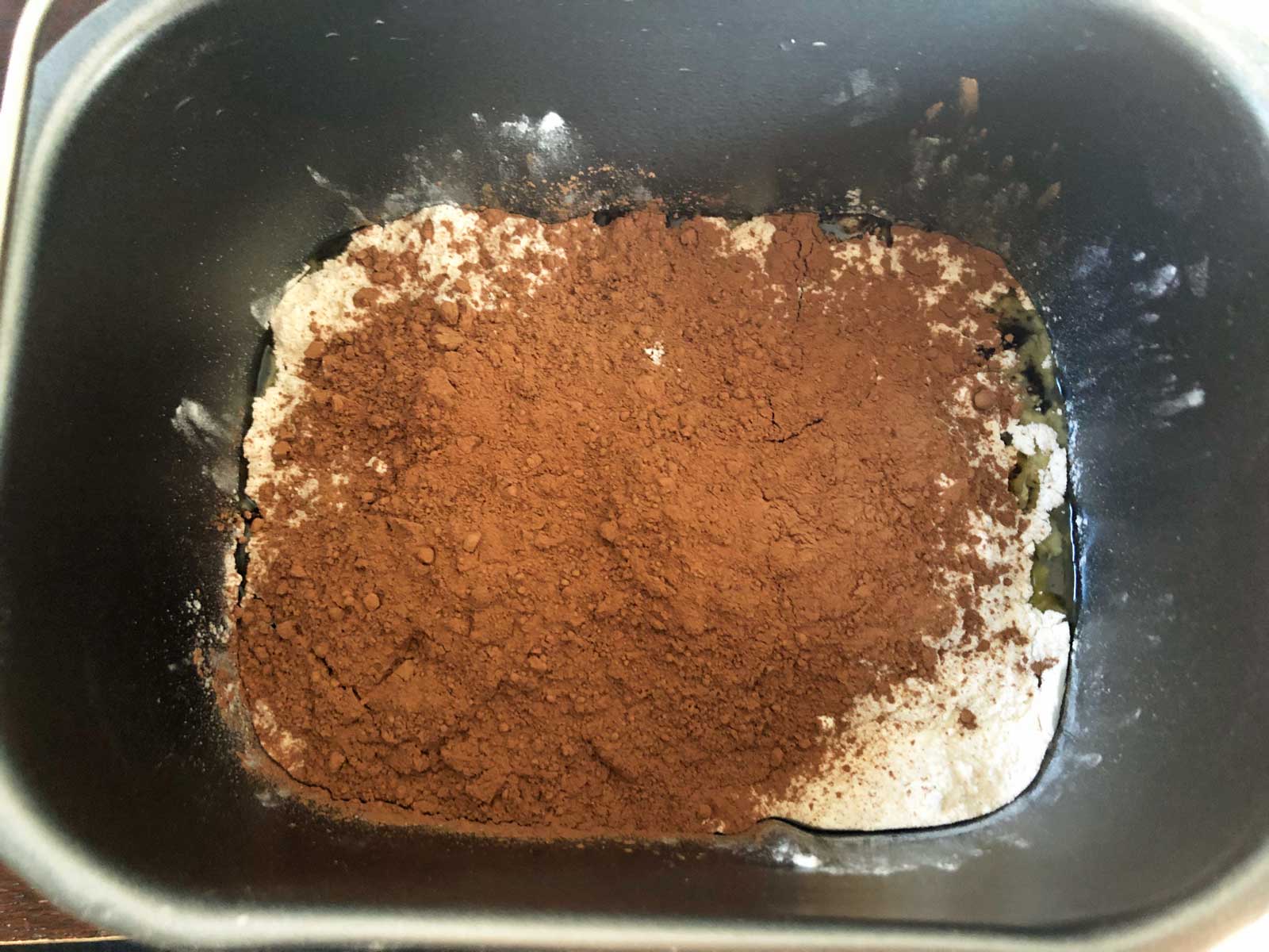 Chocolate cake ingredients in a bread machine.