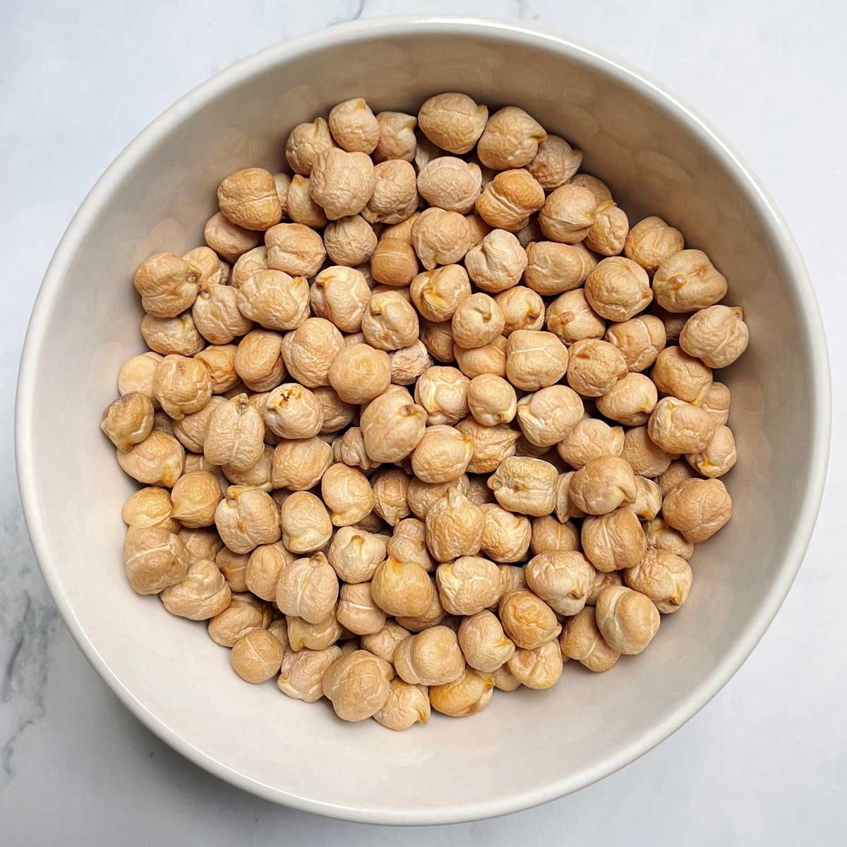 Unsoaked chickpeas in a bowl.