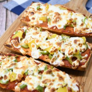 French bread pizza on a platter.