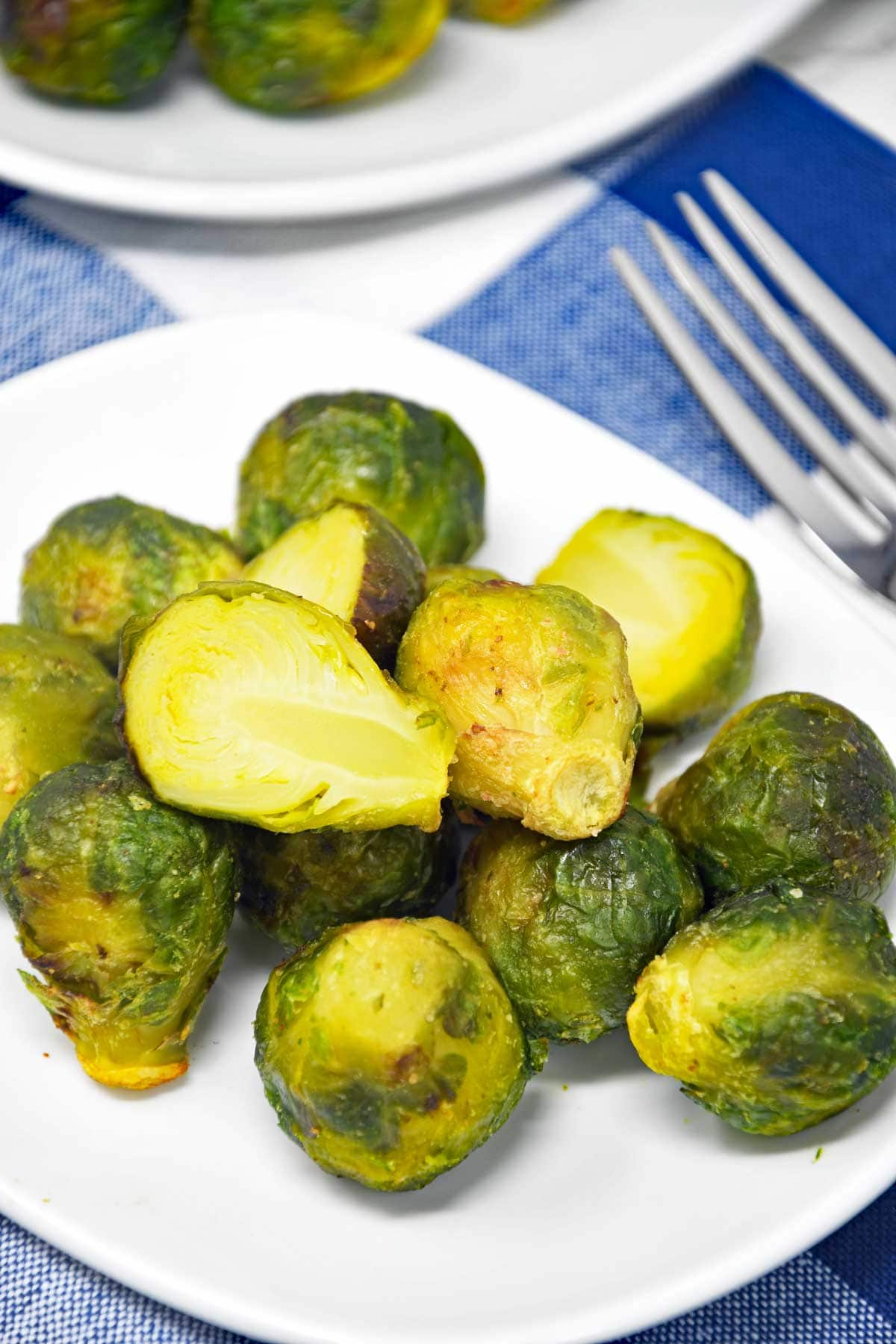 Air fryer frozen Brussels sprouts served in a plate.