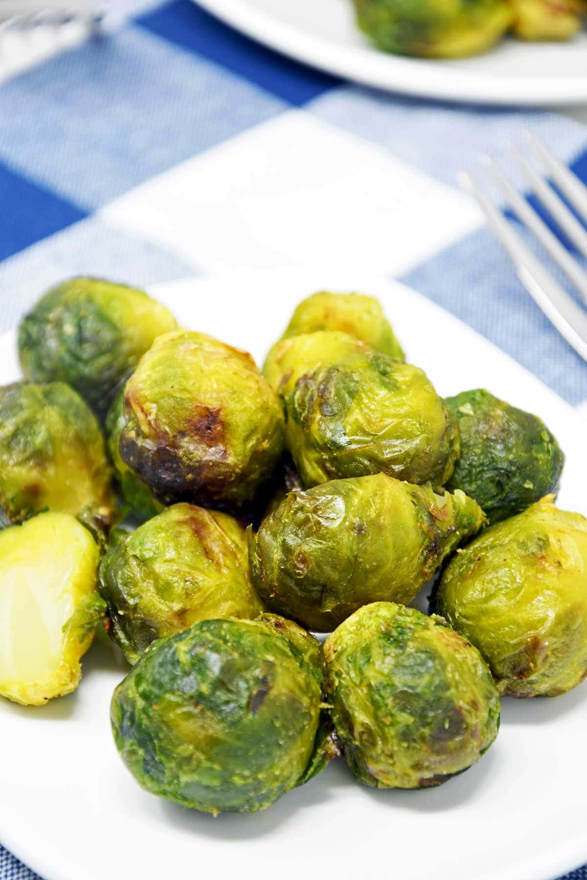 Air fryer frozen Brussels sprouts served in a plate.