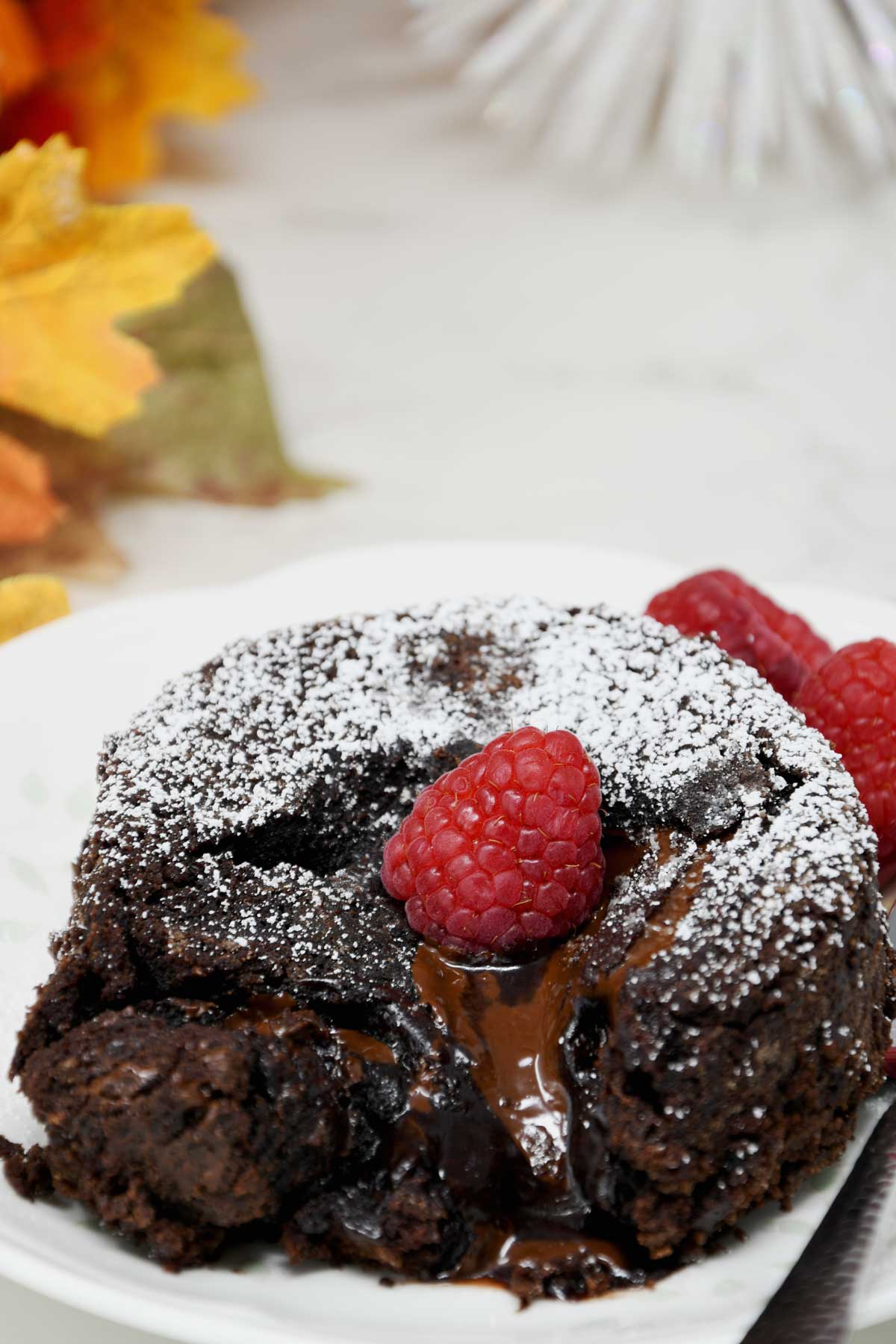Lava cake with raspberry topping.