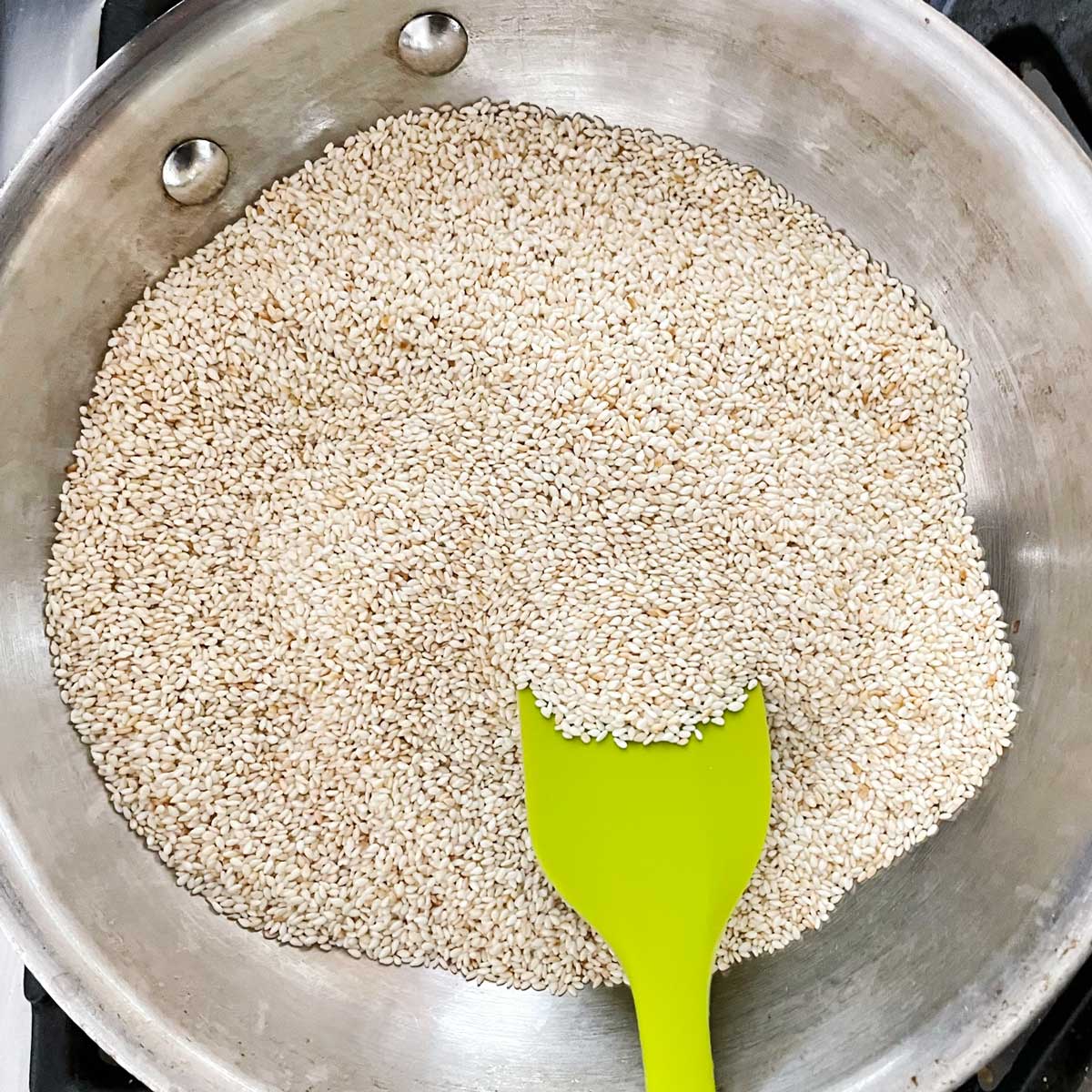 Sesame seed roasted in a pan.