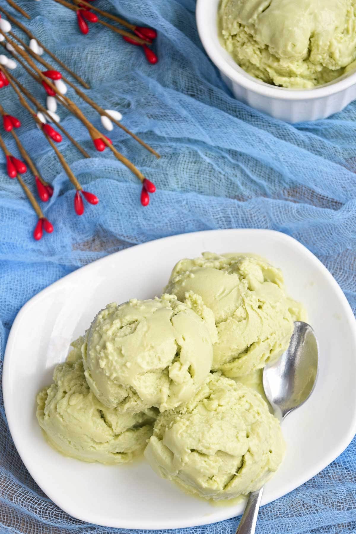 Avocado ice cream scoops in a plate.