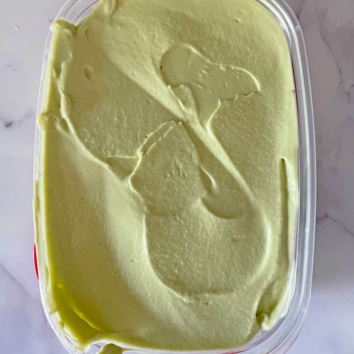 Avocado Ice cream in container.