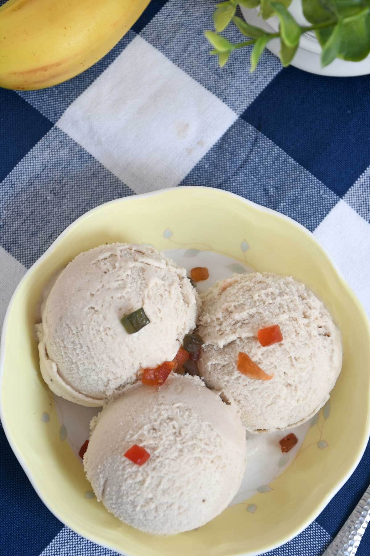 banana ice cream scoops in a bowl.