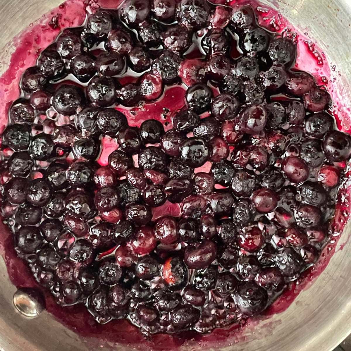 Blueberry cooking in a skillet.