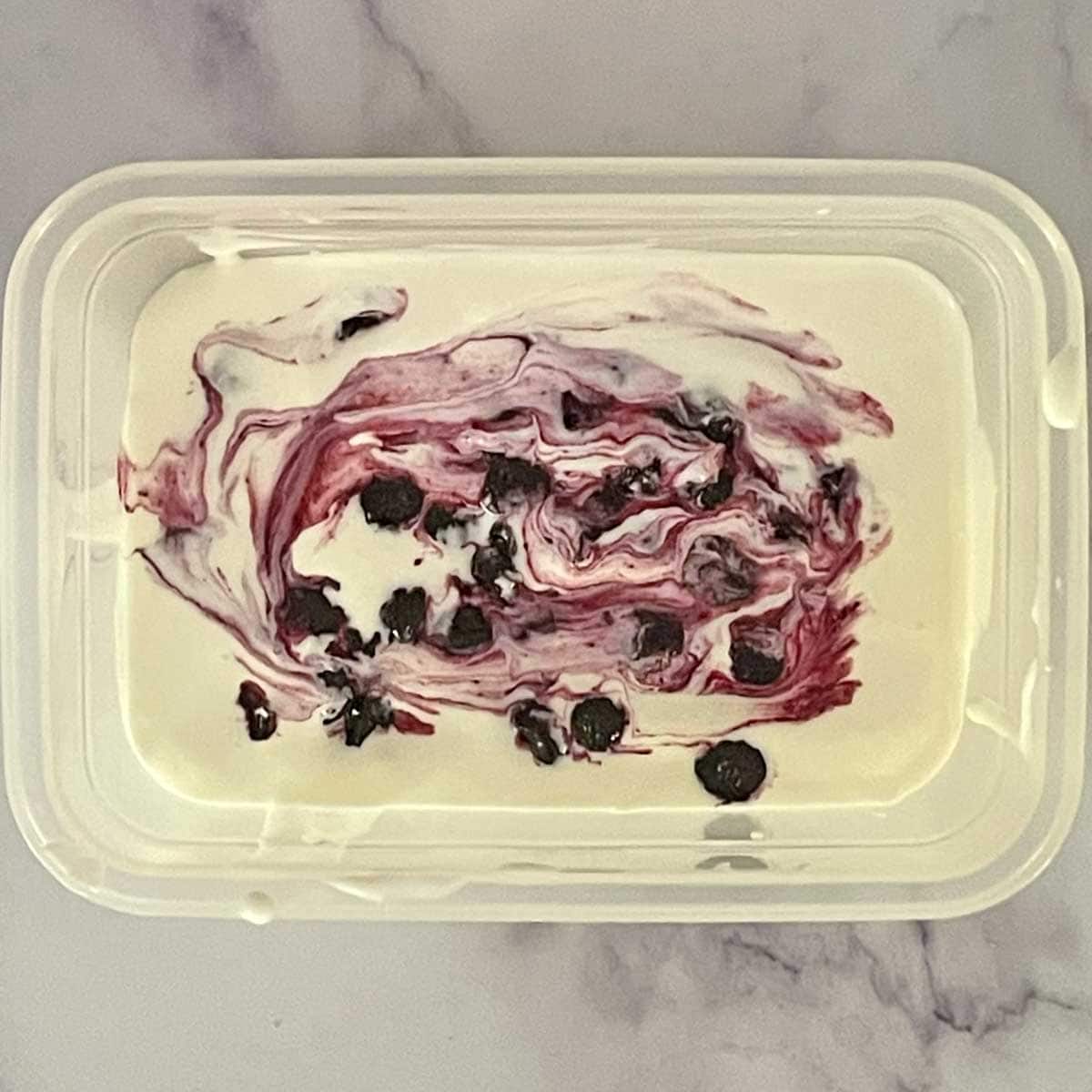 Layers of cream cheese and cooked blueberries.