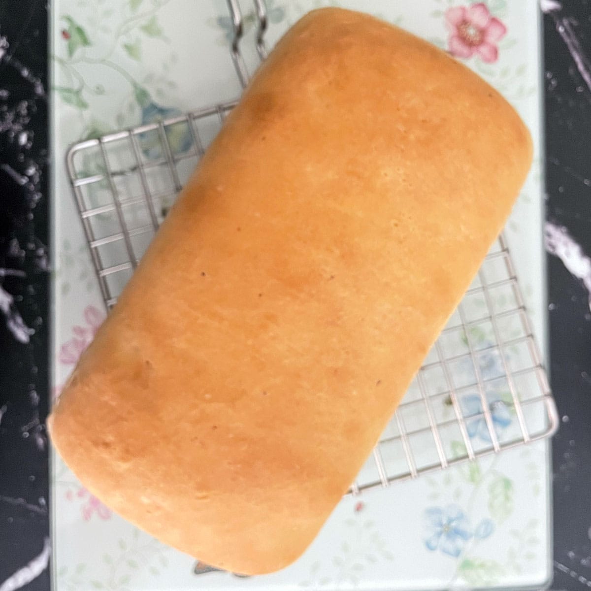 Cottage cheese bread on cooling rack.