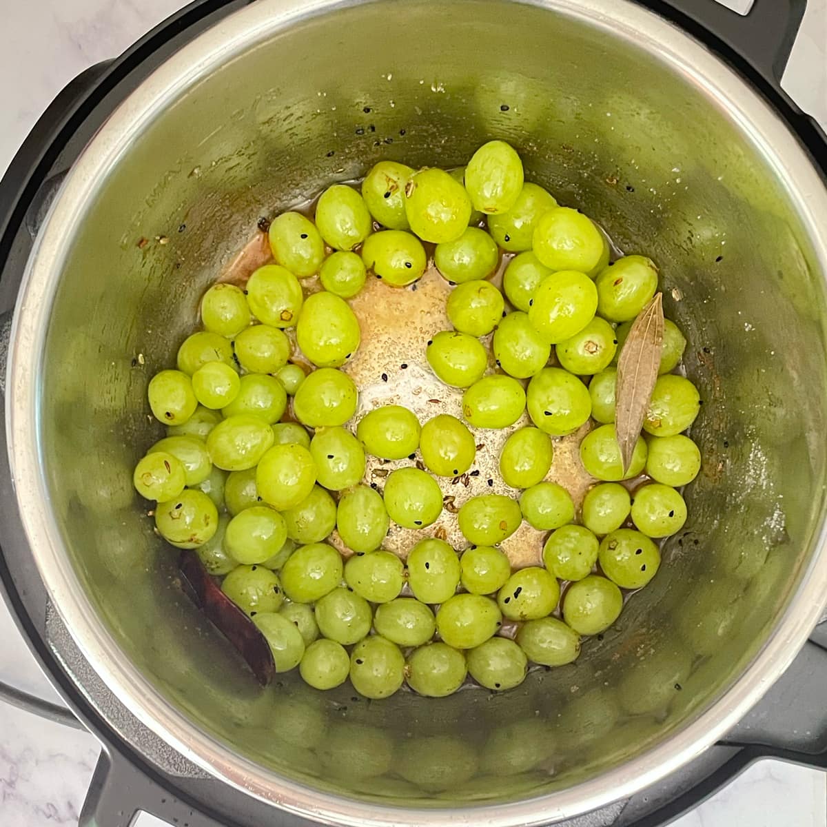 Grape chutney ingredients in instant pot .