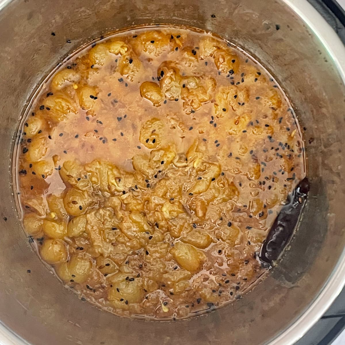 Mashed grape chutney in instant pot.