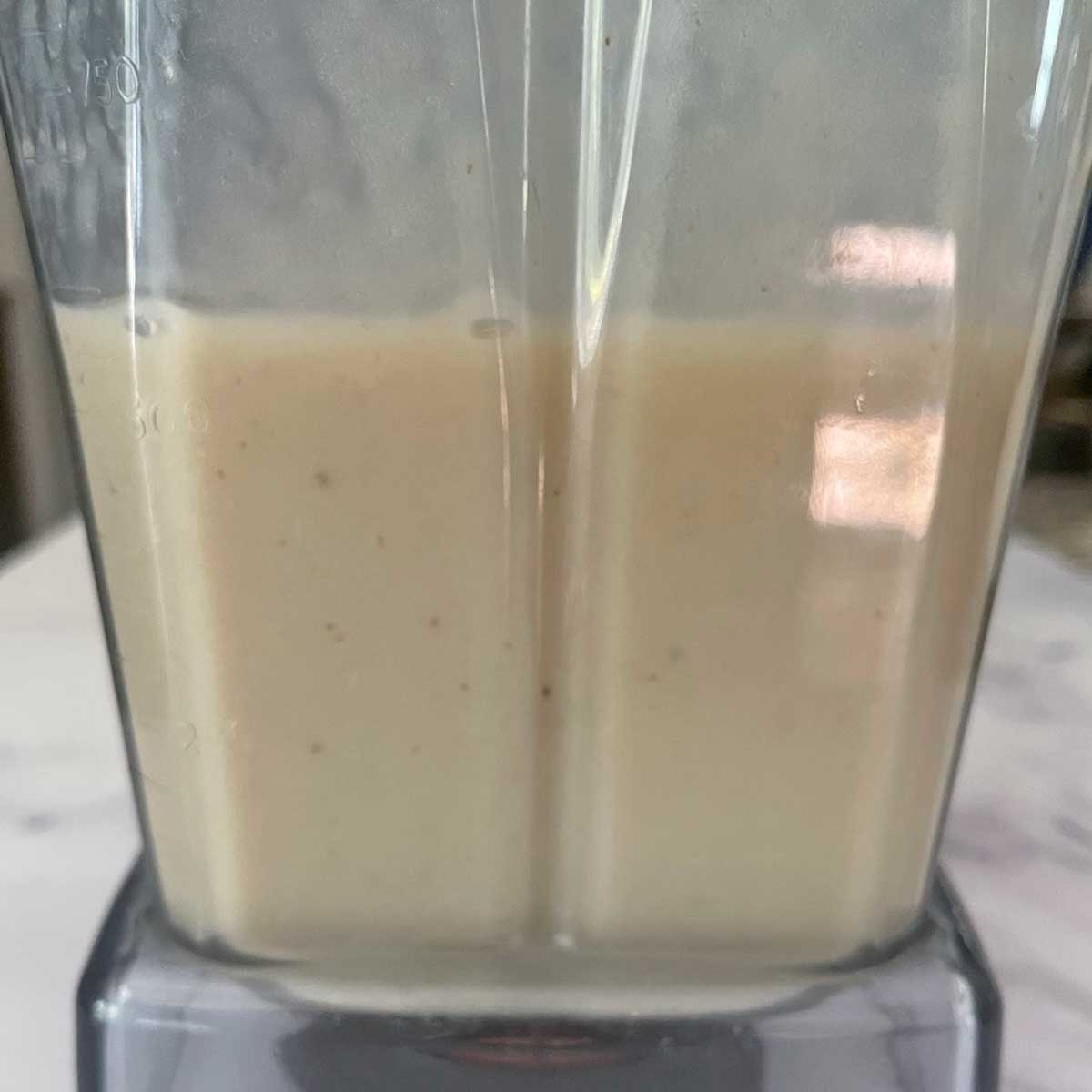 Blended mix for banana ice cream in a jar.