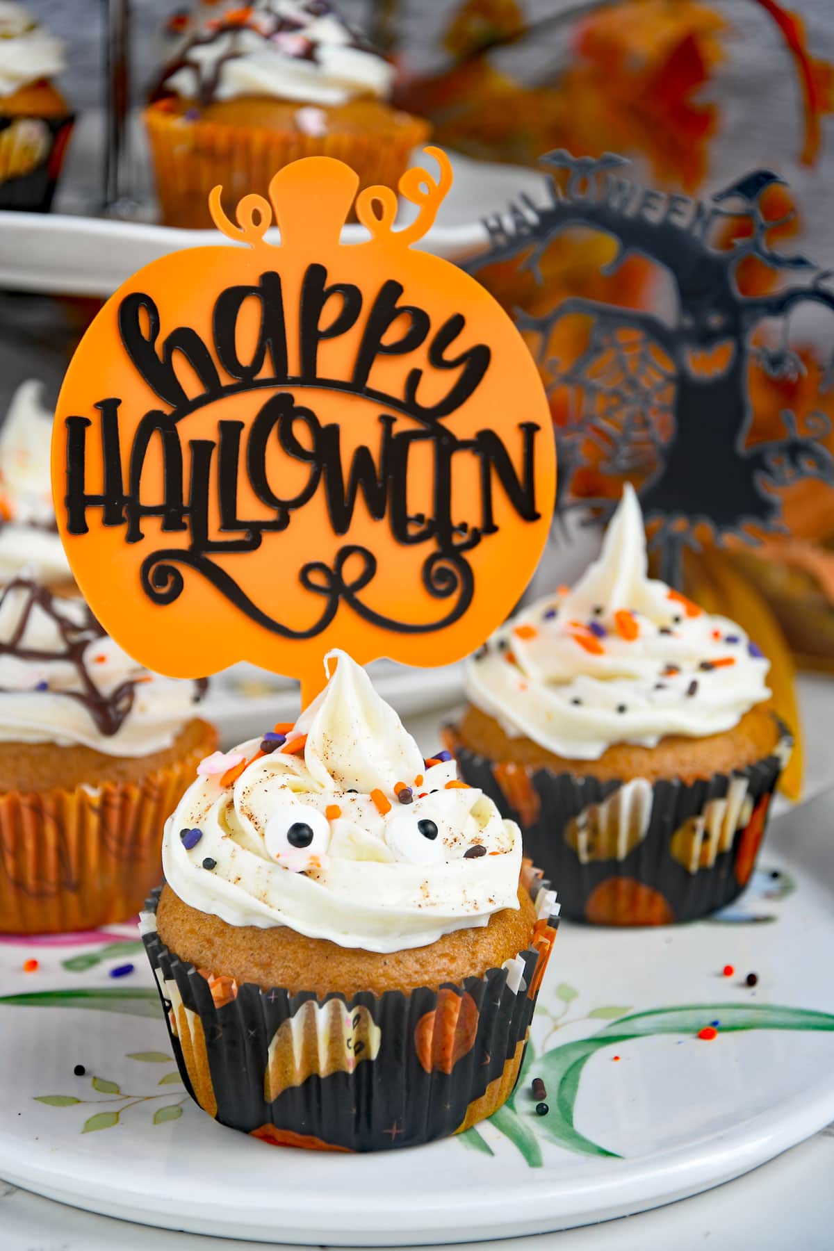 Pumpkin cup cakes with halloween decoration.