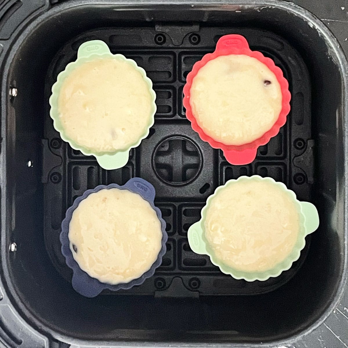 Banana muffin batter in moulds.