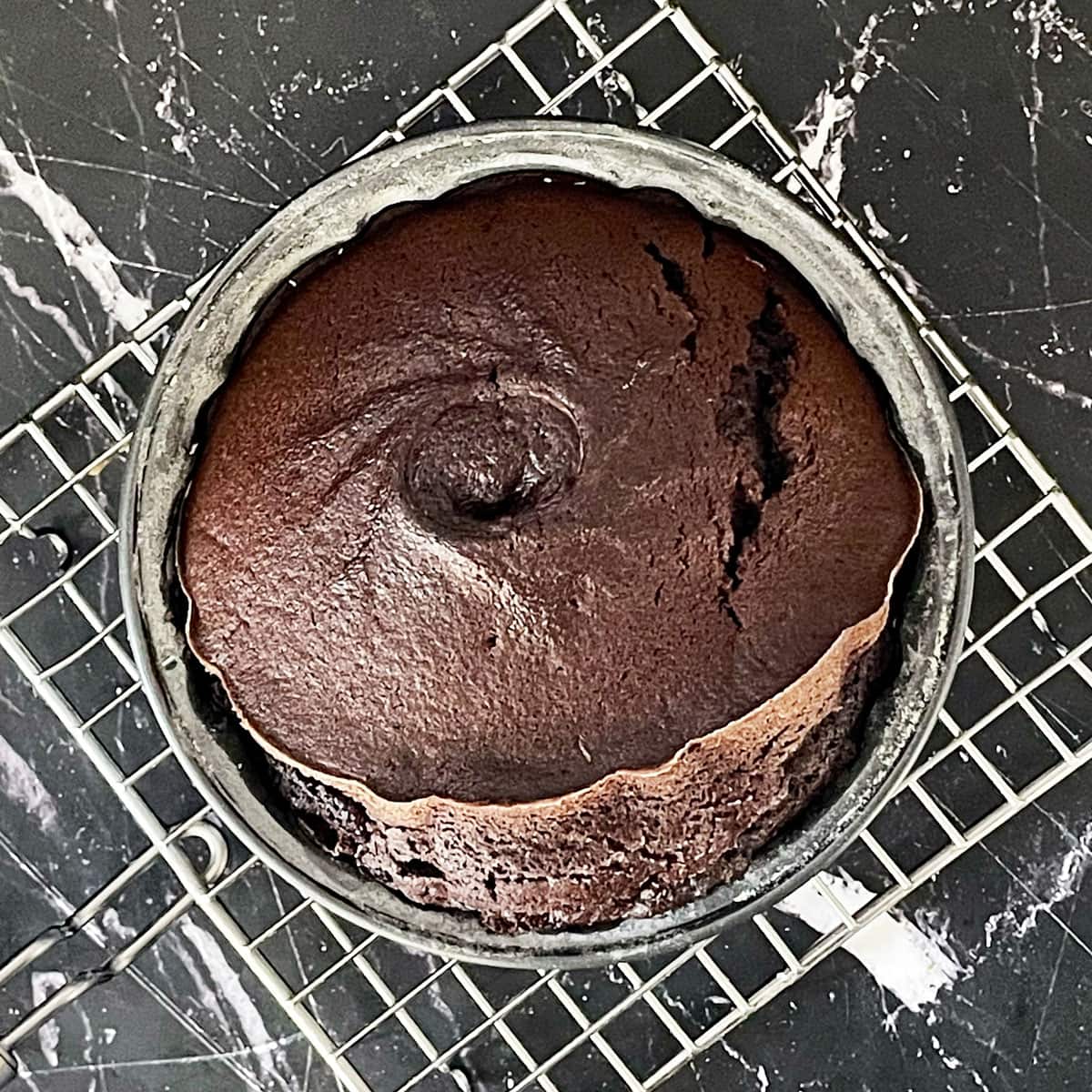 Chocolate cake baked in Air fryer on cooling rack.