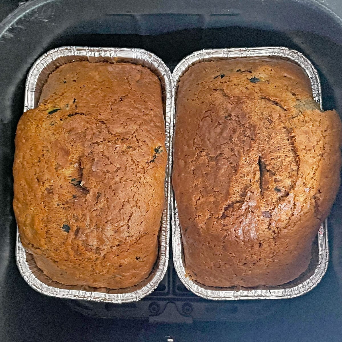 Baked zucchini bread loaves in air fryer.
