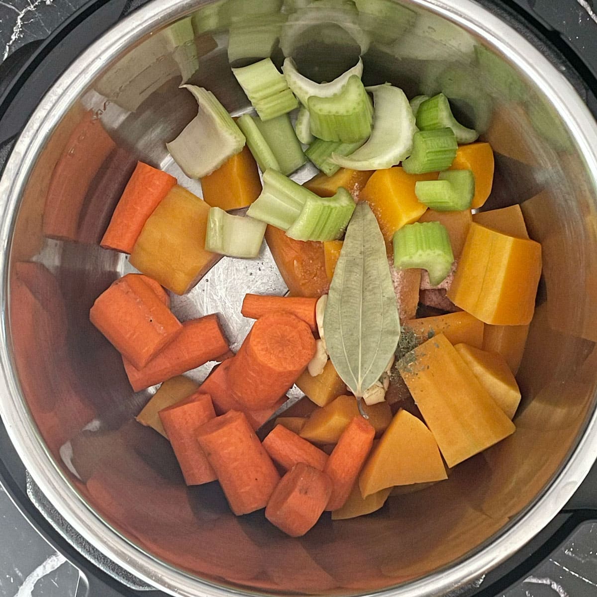 Butternut squash chopped ingredients sauteed in Instant pot.