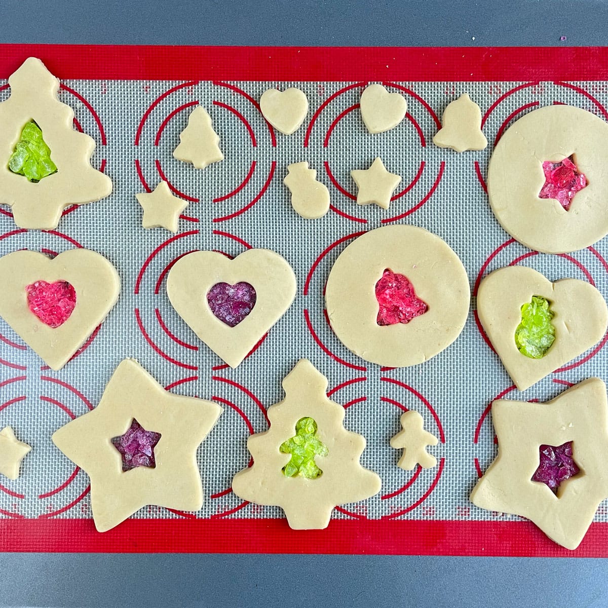 Stained glass cookies in a baking tray.