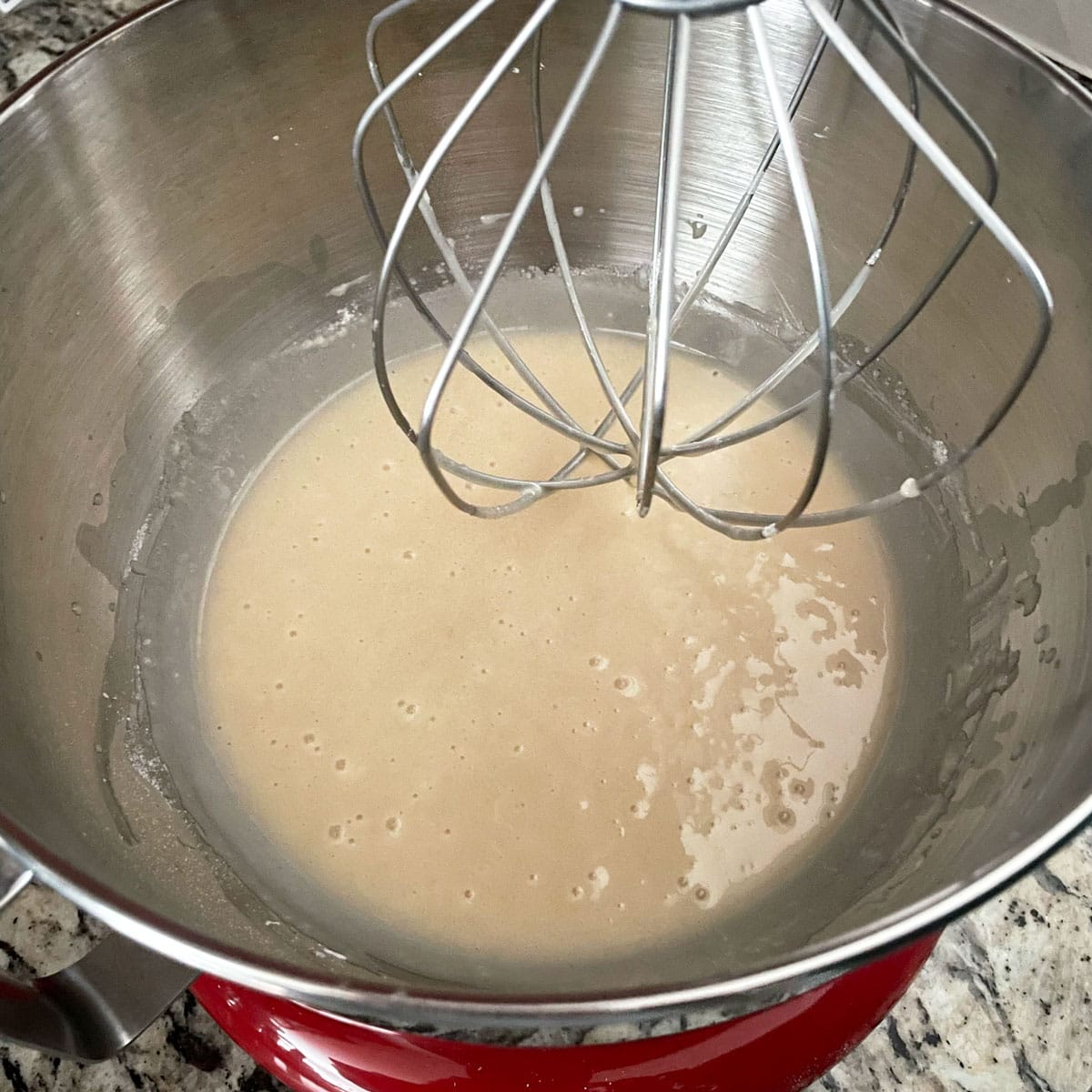 Vanilla cupcake batter in mixing bowl.