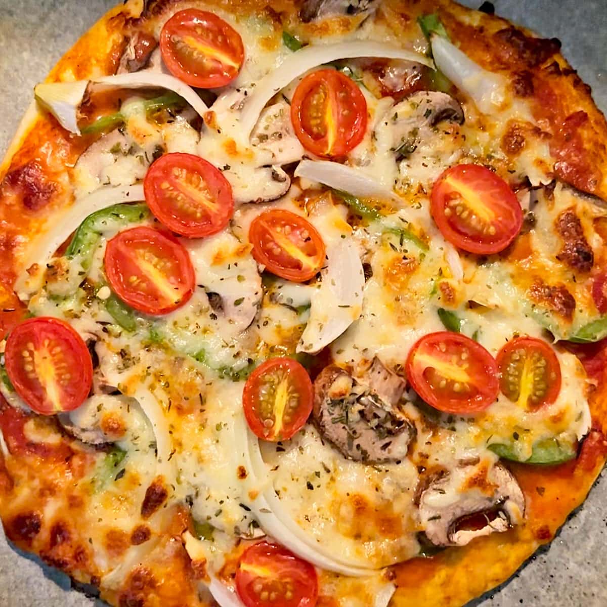 Baked thin crust pizza.